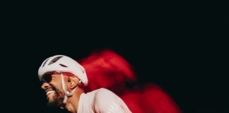 Cyclist enjoying a fast ride at night.