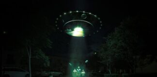 a group of people standing in front of a lighted archway