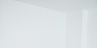 3 women sitting on gray couch