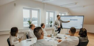 a man giving a presentation to a group of people