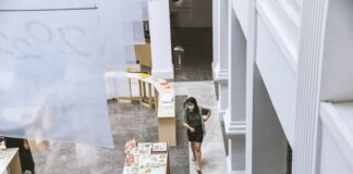 a man walking down a hallway