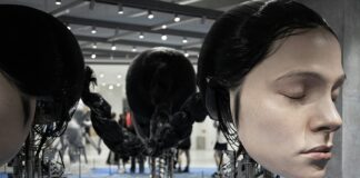 A group of mannequins with headphones on