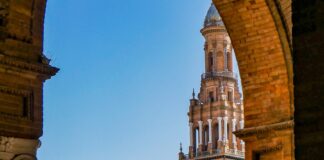 a view of a large building with a bridge in front of it