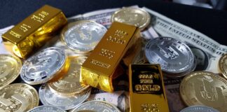 a pile of gold bars sitting on top of a pile of money