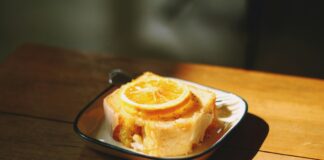sliced lemon on top of sliced cake on white ceramic plate