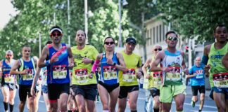 group of people running on the street