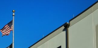 an amazon store with a person sitting in front of it