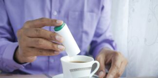 person holding white ceramic mug