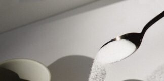 white ceramic mugs on white table