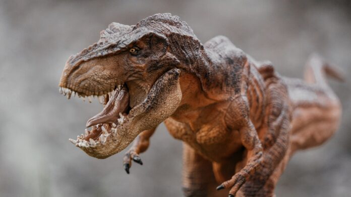 a close up of a toy dinosaur with its mouth open