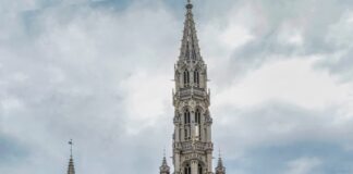 people walking near white concrete building during daytime