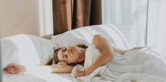 a person lying in a bed