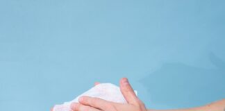 person holding white tissue paper