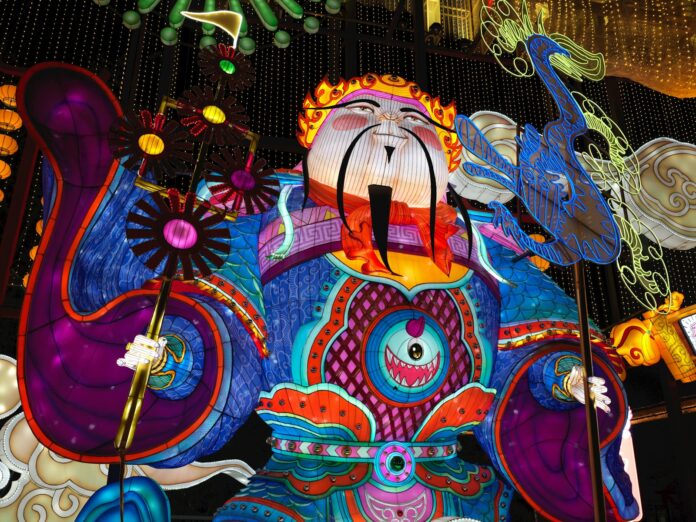 A colorful statue of a person with a cane