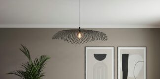 A living room with a white couch and a table