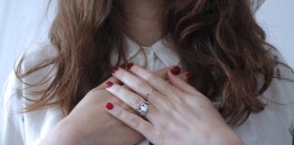 woman wearing silver-colored ring