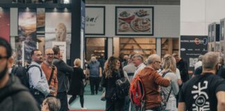 a group of people standing around in a room