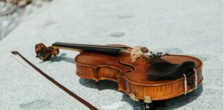 a violin on a white surface