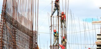 people working on building during daytime