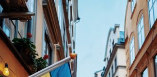 people at the street between commercial buildings