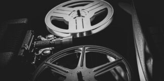 a black and white photo of a movie projector