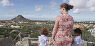 Woman and two children looking at landscape