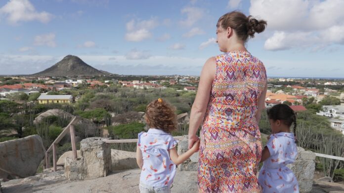Woman and two children looking at landscape