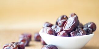 brown round fruit on white ceramic bowl