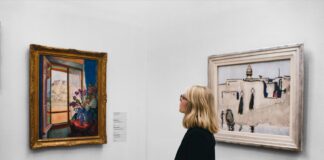 woman looking at painting