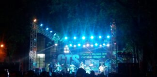 group of students standing beside stage