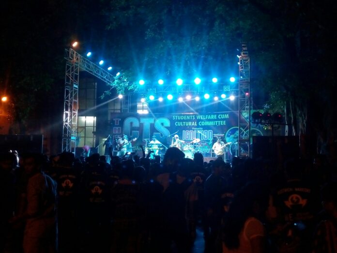 group of students standing beside stage