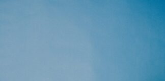 smiling woman wearing gray hoodie