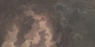 Volcano erupting with ash and debris over a city.