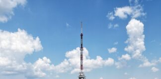 a very tall tower with a sky background