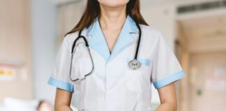 woman in white button up shirt and blue stethoscope