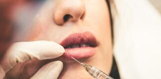 woman holding pen and white cotton candy