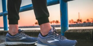 person wearing blue and white running shoes
