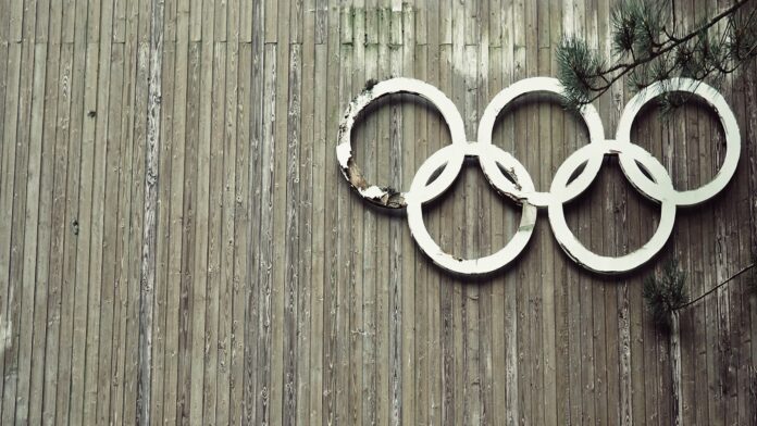 Olympic symbols on wooden wall