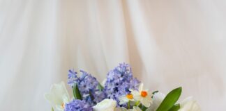 white and purple flower bouquet in white ceramic vase