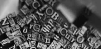 black and white photograph of a bowl of alphabets