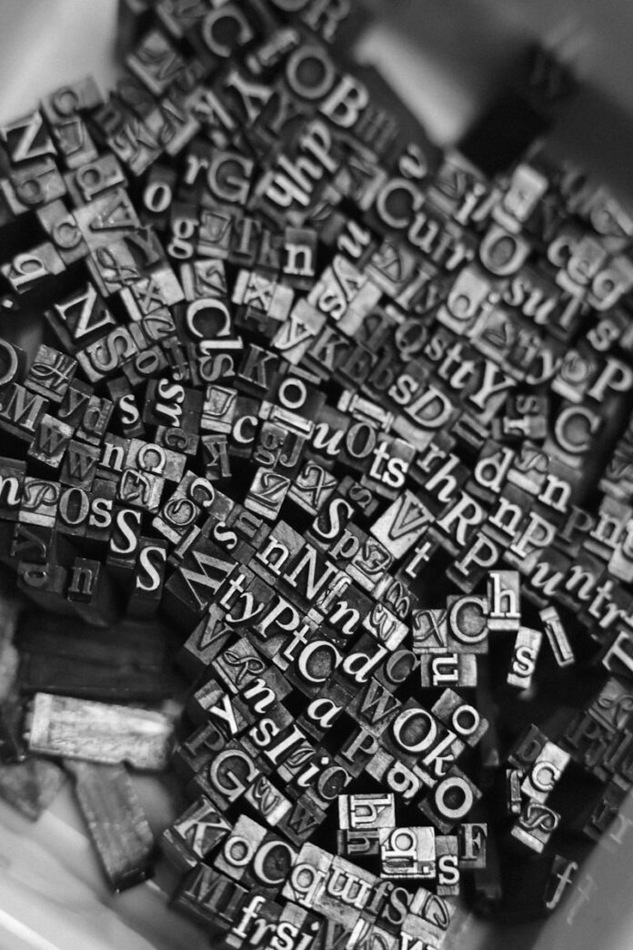 black and white photograph of a bowl of alphabets