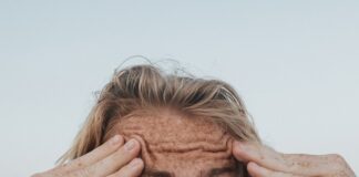 man in gray crew neck shirt with brown hair