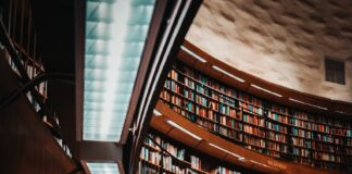 photo of brown wooden bookshelf