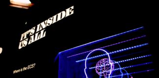 a neon display of a man's head and brain