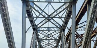 brown metal bridge over the river