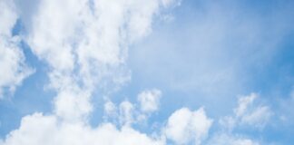 green mountain under white clouds during daytime