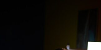 a man sitting at a desk in front of a computer