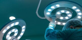 a group of doctors performing surgery on a patient