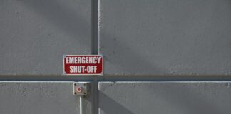 emergency shut-off button on wall