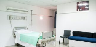 hospital bed near couch